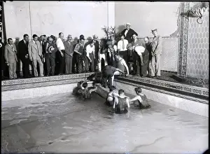 Stunt Prints: Houdini In Casket Being Lowered Into Poo