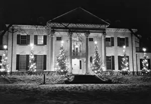 House in Winter With Christmas Lights