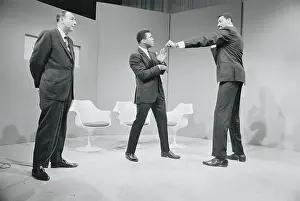 Prints of As Howard Cosell looks on, Muhammad Ali (center) attempts to ward off a playful jab thrown by Wilt Chamberlain just before the taping of a television show Frazier's Fury: Iconic Moments: Howard Cosell Watching Muhammad Ali and Wilt Chamberlain