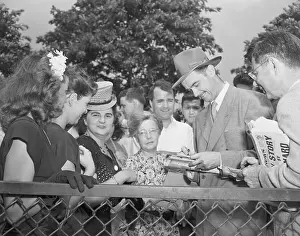 Howard Hughes giving autograph