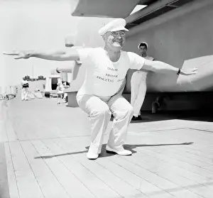 Crouching Prints: H.S. Truman Leading Calisthenics On Ship
