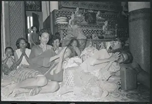 Huddled Villagers Praying