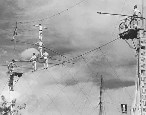 Human Pyramid Moving Across Tightrope