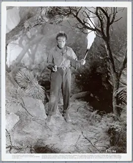 Torch Prints: Humphrey Bogart Holding a Torch and Gun