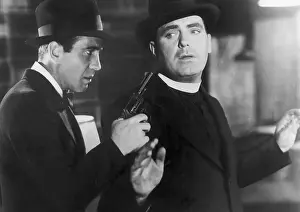 Humphrey Bogart Holds Gun On Priest/Movi