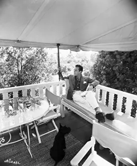 Awning Prints: Humphrey Bogart Lounging And Pet On Deck