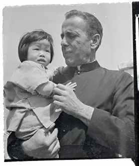 Humphrey Bogart Posing with Little Girl on Set