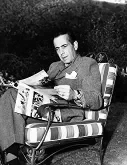 Prints of (Original Caption). Humphrey Bogart, star of Warner Bros. Chain Lightening, in the garden of his Beverly Hills home The Essence of Cool: Humphrey Bogart Relaxing at Home
