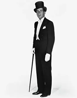 Prints of (Original Caption). Humphrey Bogart, a born New Yorker, who is now in Hollywood acting in Fox Film Productions, gives you an idea of what the well dressed first nighter wears to the theater The Essence of Cool: Humphrey Bogart Wearing Tuxedo and Top Hat