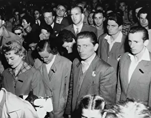 Prints of Members of the Hungarian Olympic team look dejected as they listen to their national anthem being played on arrival at Essendon airport, Melbourne, November 12th 1956 Bettmann Archive Prints: Hungarian Athletes Arriving For Melbourne Olympics