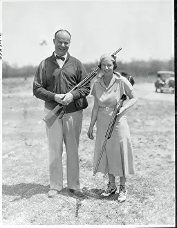 Pinehurst Prints: Husband and Wife Holding Rifles