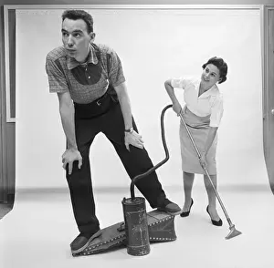 Carpet Prints: Husband and Wife Operate Bellows Vacuum
