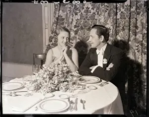 Husband and Wife Seated at Club