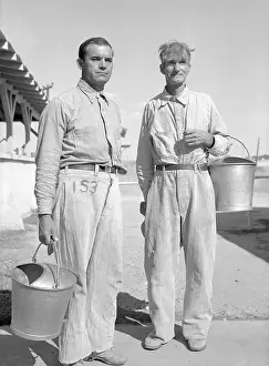 I.C. Spencer and Price Johnson Holding Buckets