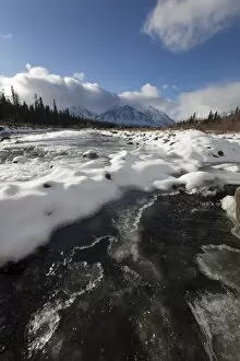 Ice, snow and water at freezing Quill Creek, St. Elias Mountains, Kluane Range behind, Kluane National Park and Reserve