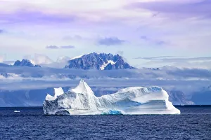 Images Dated 24th July 2010: Iceberg and mountains at sunrise, Kujalleq, Prinz Christian Sund fjord, Greenland