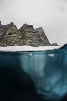 Iceberg and Rock Face