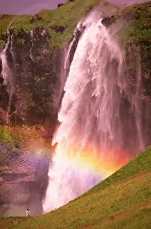 Iceland, Seljalandfoss (waterfall) with rainbow, summer