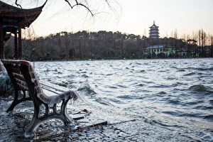 Images Dated 24th January 2016: Icicles on bench against the Leifeng Pagoda by the West Lake, Hangzhou, Zhejiang, China