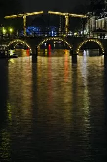 Images Dated 18th January 2014: Illuminated Amsterdam Canal and Bridge