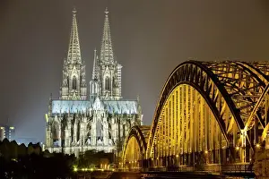The illuminated Cologne Cathedral and Hohenzollern Bridge at night, Deutz, Cologne
