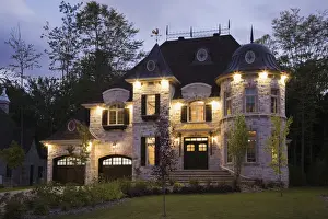 Country House Prints: Illuminated luxurious cottage-style residential house with two garages