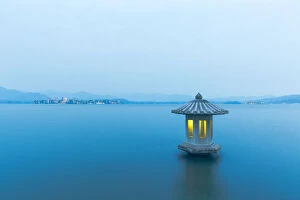 Images Dated 12th March 2016: A illuminated stone lantern on the West Lake, Hangzhou, China