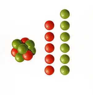 Comparison Prints: Illustration showing relative atomic mass of nucleus of boron-11 containing five protons and six neutrons
