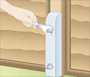 Human Hand Prints: Illustration of using spanner to fasten spur to wooden fence post with galvanized bolt
