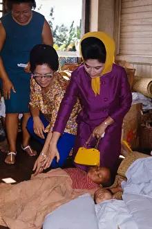 Imelda Marcos Greeting Ill Child with Family Nearby