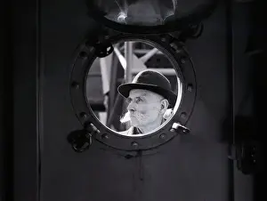Immigrant Man Staring Through Porthole