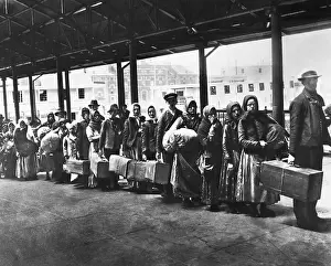 Carrying Prints: Immigrants On Line On Ellis Island