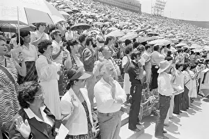 Immigrants Take Oath And Hold Umbrellas