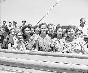Immigrants Stand at Ship Railing