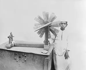 Mumbai Prints: Indian Boy with Weaving Utensil