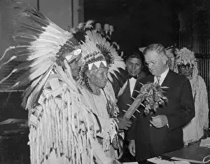Indian Chiefs and Secretary of Interior Examining Native War Club