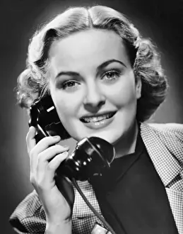 Indoor portrait of woman on telephone