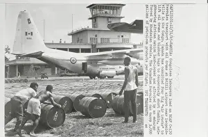 Zambia Prints: Industry Workers Moving Cannisters on Airport Grounds