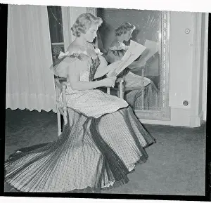 Ingrid Bergman Looking at Sketch of Dress She is Wearing