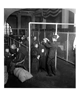 A US Inspector Examining The Eyes Of Arriving Immigrants On Ellis Island, New York Harbor