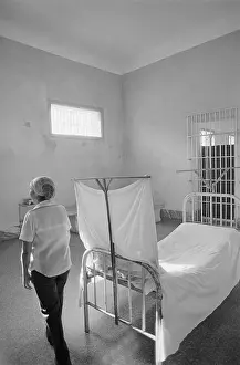 Interior View of Jail Cell With Bed