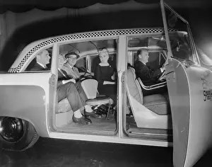Checked Pattern Prints: Interior View of Passengers Inside a New York City Checker Cab