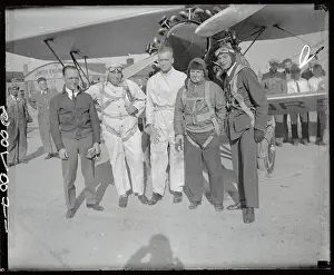 International Pilots Posing in Front of Plane