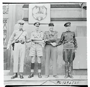 International Soldiers Conducting Four Way Handshake