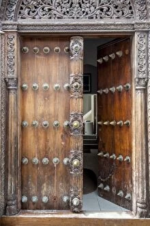 Tanzania Gallery: Intricately carved wooden Arab door in Stone Town