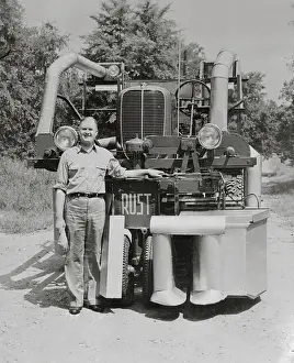 Inventor Posing with Cotton Picker