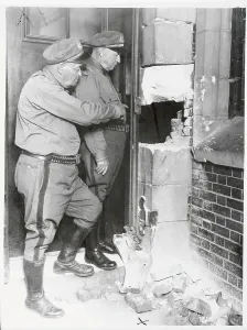 Marion Prints: Investigators Inspectijng Wall