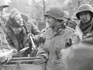 Iris Carpenter Interviewing American Troop in the Field