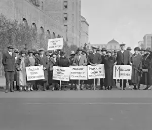 Irish Protesters Carrying Signs in Street