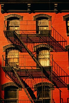 New York's Iconic Fire Escapes Collection: Iron emergency staircase on facade of apartment building
